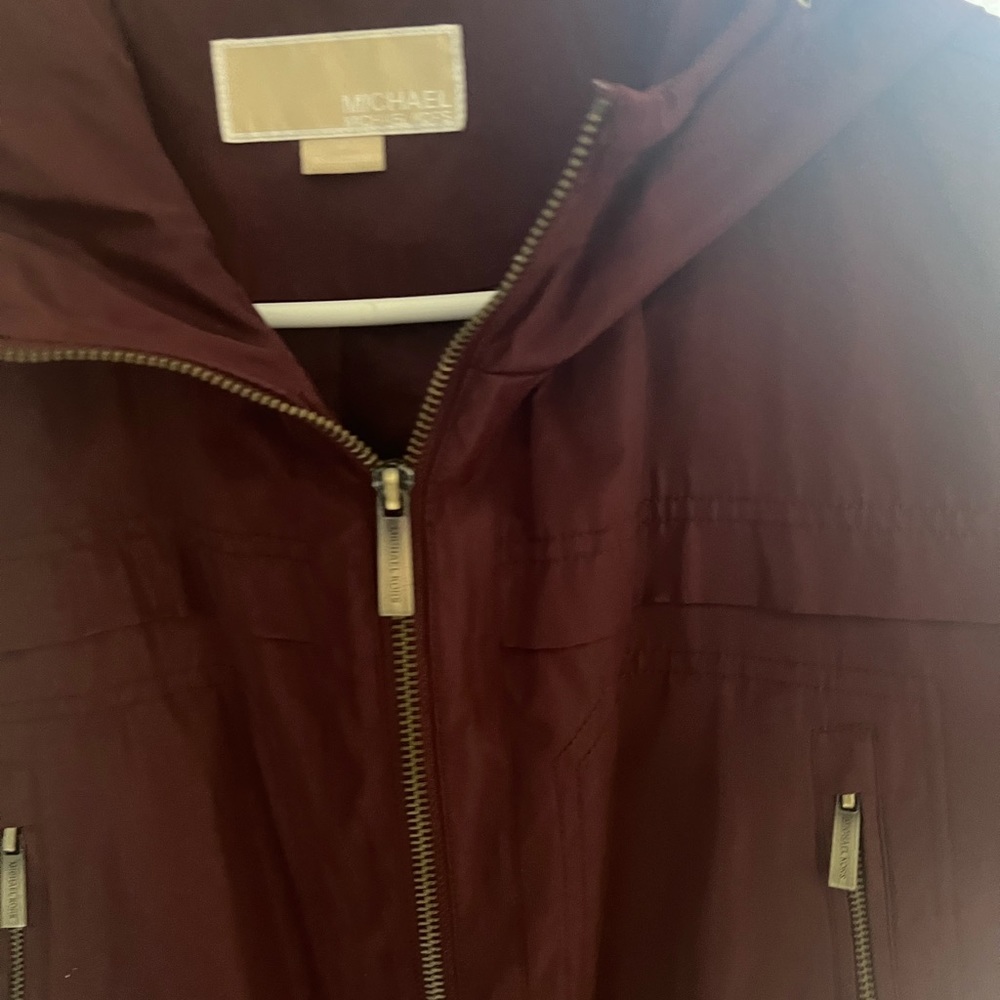 This is really a burgundy color  not purple. It’s been worn, but not very often.